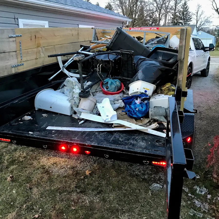 Roll-off dumpster delivered to a residential driveway in Acton